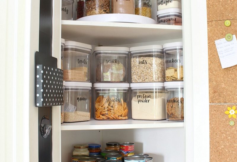 OXO airtight food storage containers in a corner lazy susan cabinet.