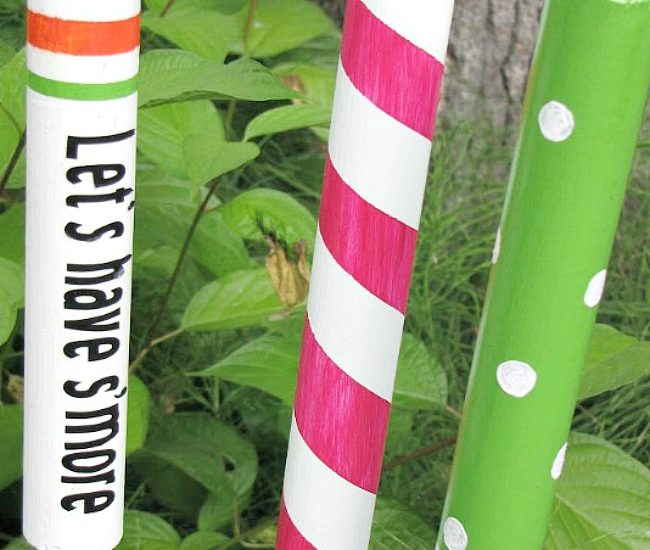 Custom DIY campfire roasting sticks with painted wood dowels.