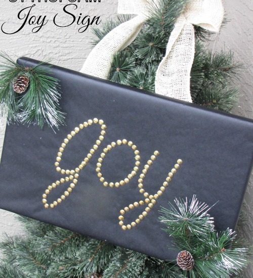 Joy sign made from Styrofoam and thumb tacks.