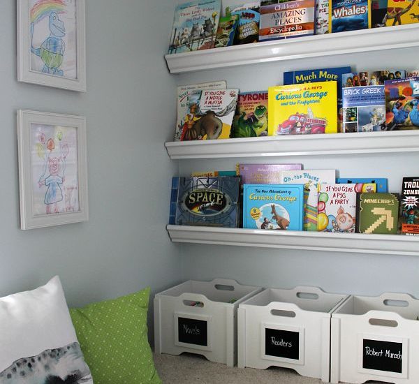 Love this cute reading nook! Encourage your kids to read with a comfy space and books that are easily accessible.