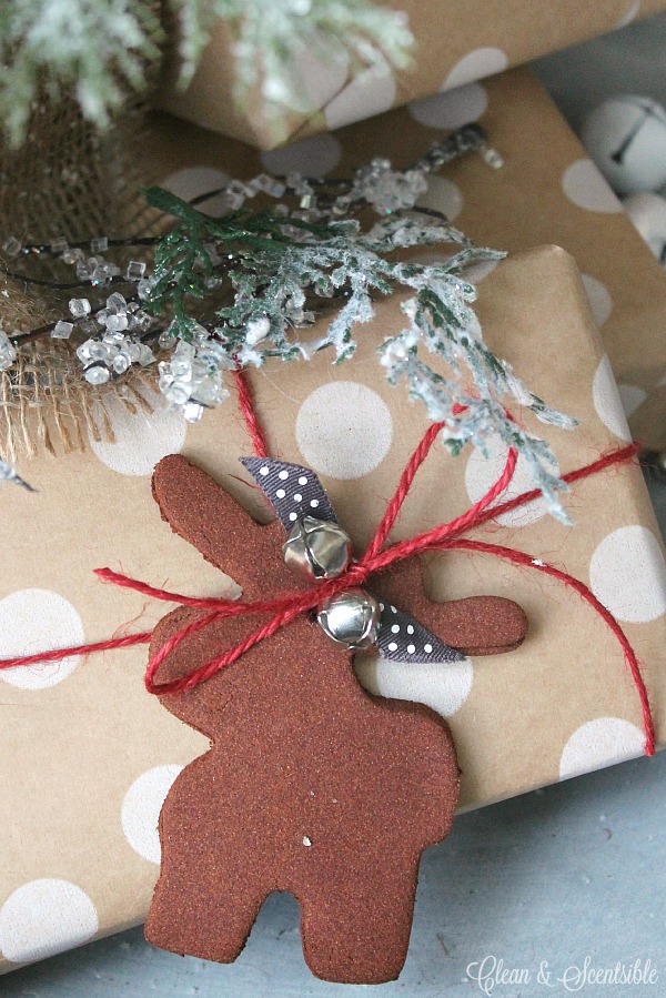 Make these cute cinnamon Christmas tree ornaments with only two ingredients! They also look super cute as gift toppers!