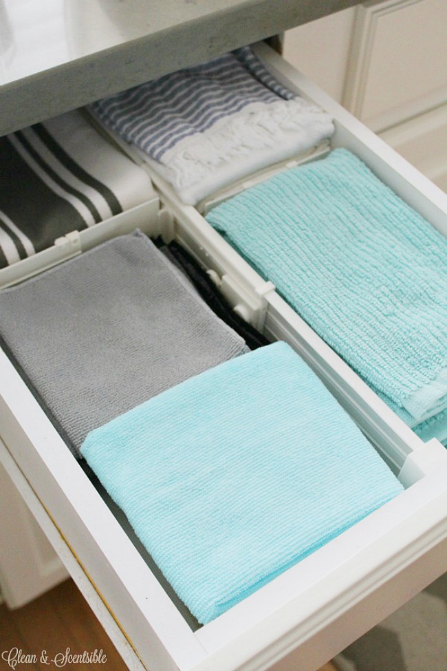 Organized kitchen drawer for kitchen towels using drawer dividers.