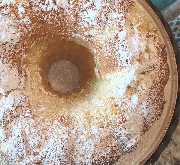 Delicious sour cream pound cake recipe with homemade whipped cream. Must try!