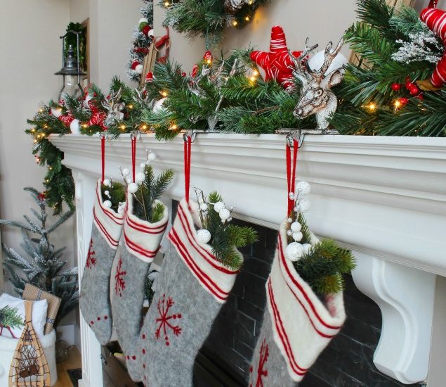 Cozy Christmas cabin Chirstmas mantel - snowy covered branches with red and white.