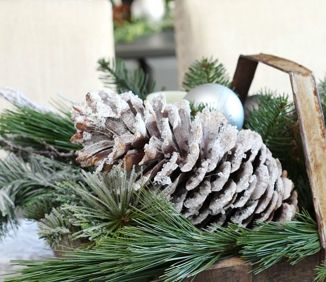 DIY icicle pinecones. All you need is a few supplies and 10 minutes to create these pretty snowy pinecones.