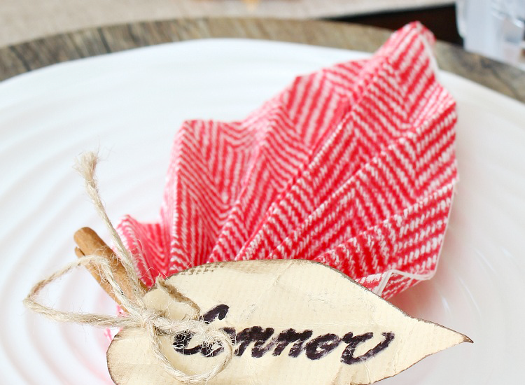 Pretty leaf napkin fold used in a pretty Thanksgiving tablescape.