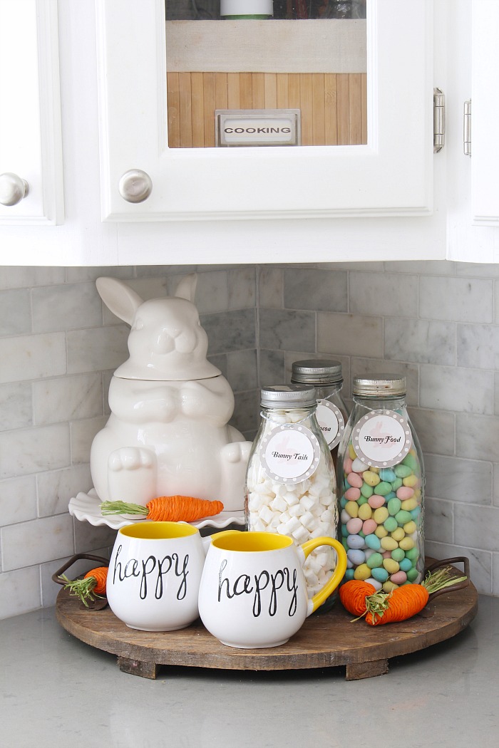 Easter hot chocolate bar with a white ceramic bunny cookies jar and milk bottles.
