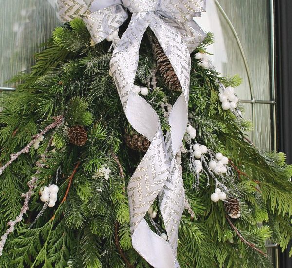 How to make a bow from ribbon. Pretty bow made from ribbon on a swag wreath.