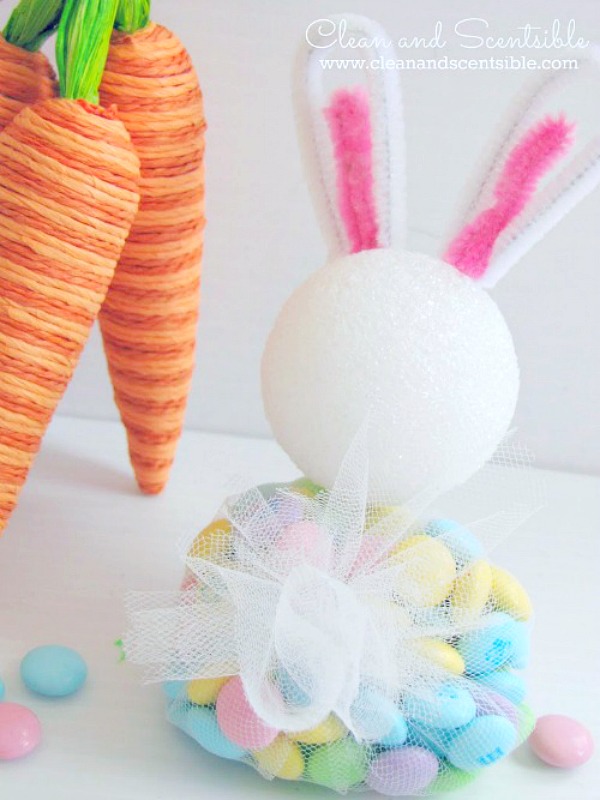 DIY Easter bunny treats using Easter colored M&Ms and some basic craft supplies. Cute tulle bunny tail in the back.