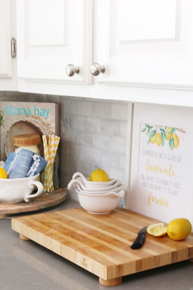 Create warmth in a white kitchen using cutting boards - Duke Manor Farm by  Laura Janning