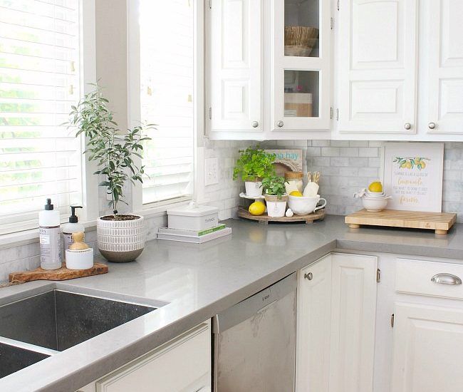 White farmhouse style kitchen with simple summer decor.