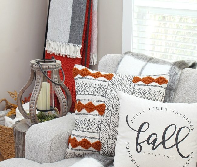 Cozy fall living room with fall pillows and cozy throws.