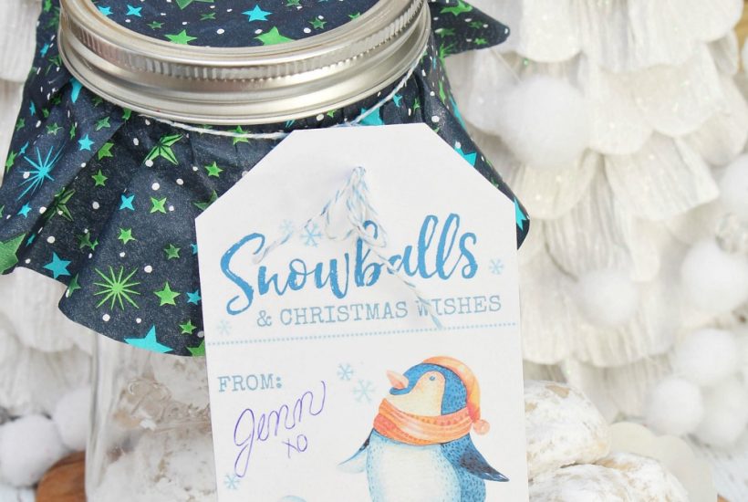 Snowball cookies on a tray and wrapped up in a mason jar gift.