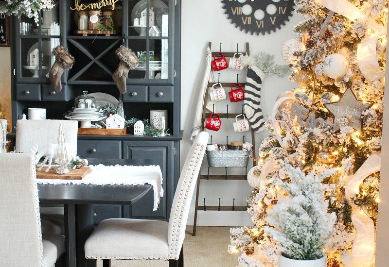 Beautiful Christmas dining room decor with flocked Christmas tree.