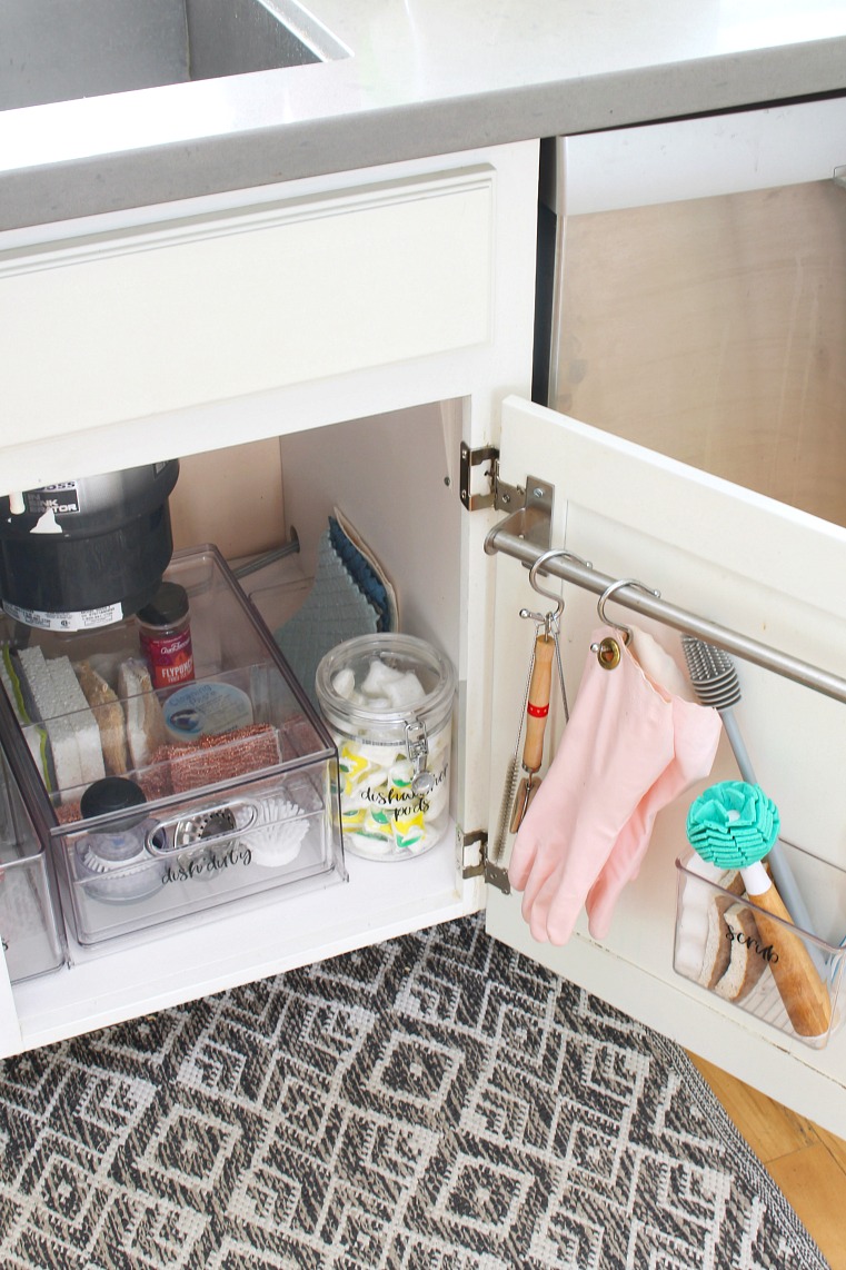https://www.cleanandscentsible.com/wp-content/uploads/2020/03/how-to-organize-under-the-kitchen-sink6-Clean-and-Scentsible.jpg