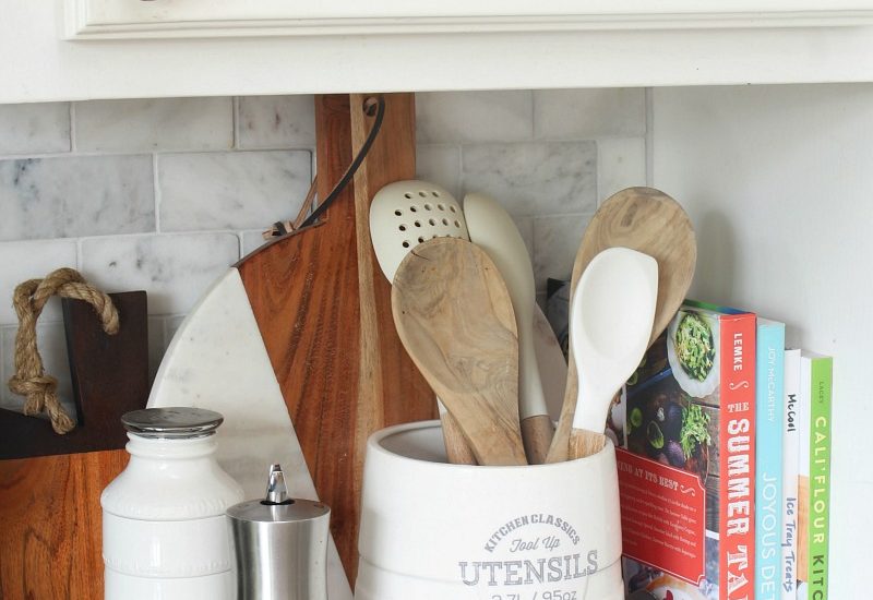 Wood tray used to corral kitchen essentials.