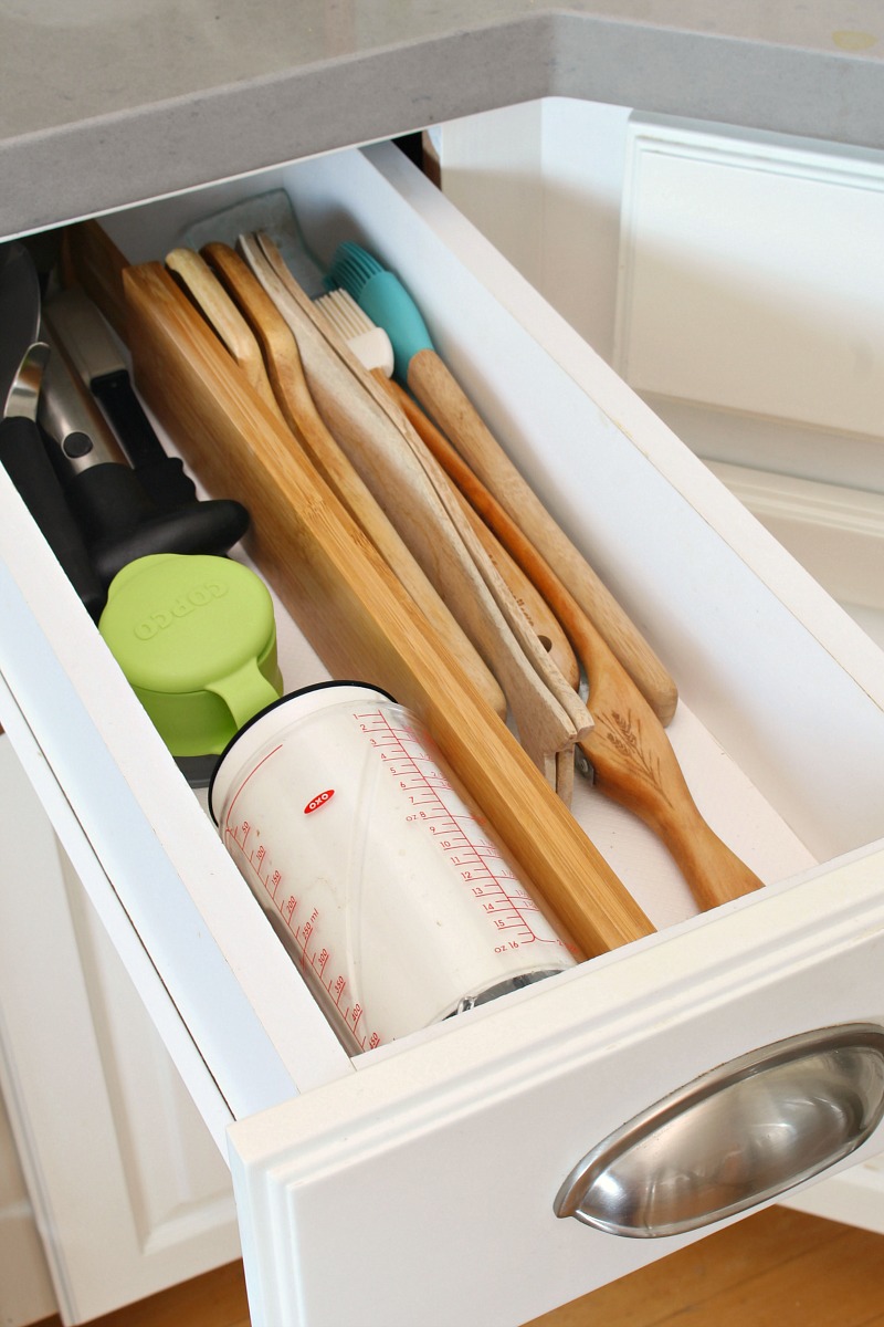 Organized utensil kitchen drawer with drawer divider.