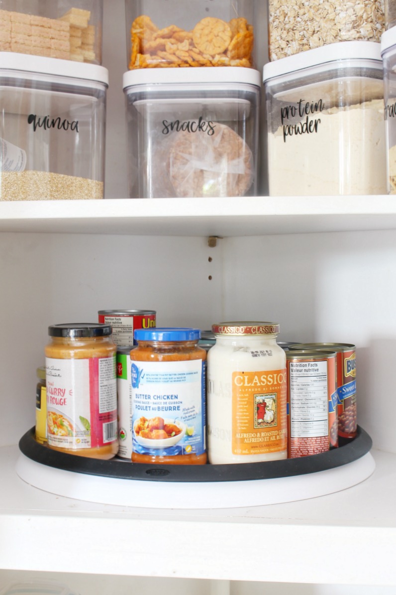 Organized kitchen pantry cabinet with lazy susan.