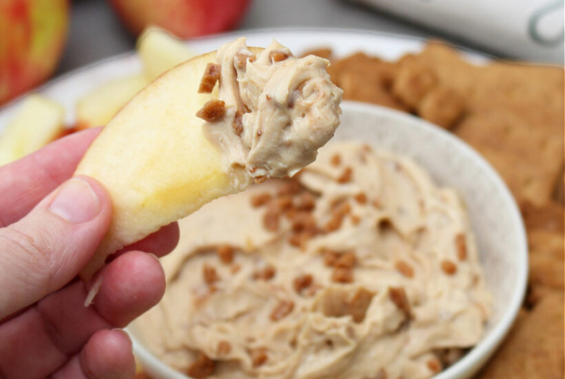 Apple dipped in cream cheese apple dip.