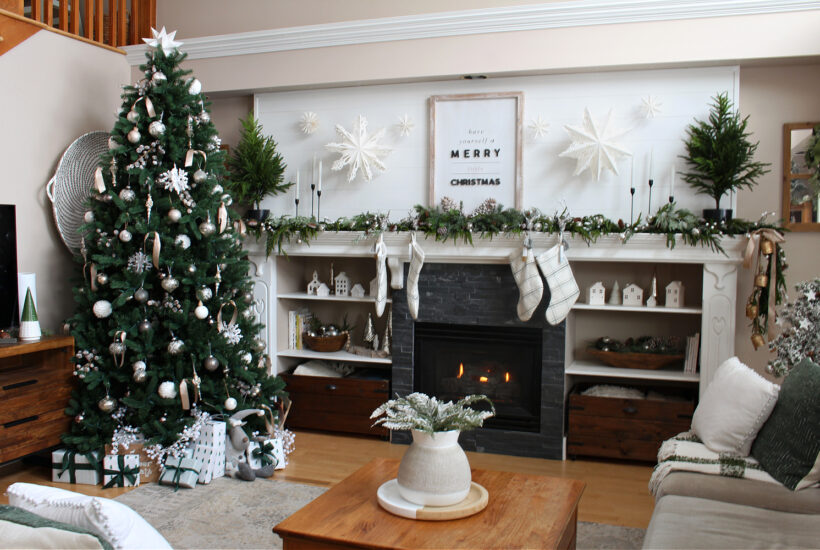 Living room decorated for Christmas with green and white.