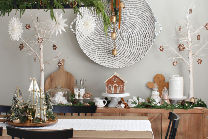 Modern dining room decorated for Christmas with a gingerbread house inspired theme.