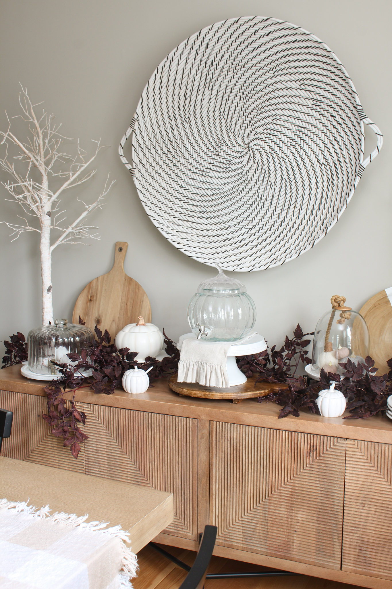 Wood sidebar decorated for fall with lighted trees, pumpkins and plum circimifuga garlands.