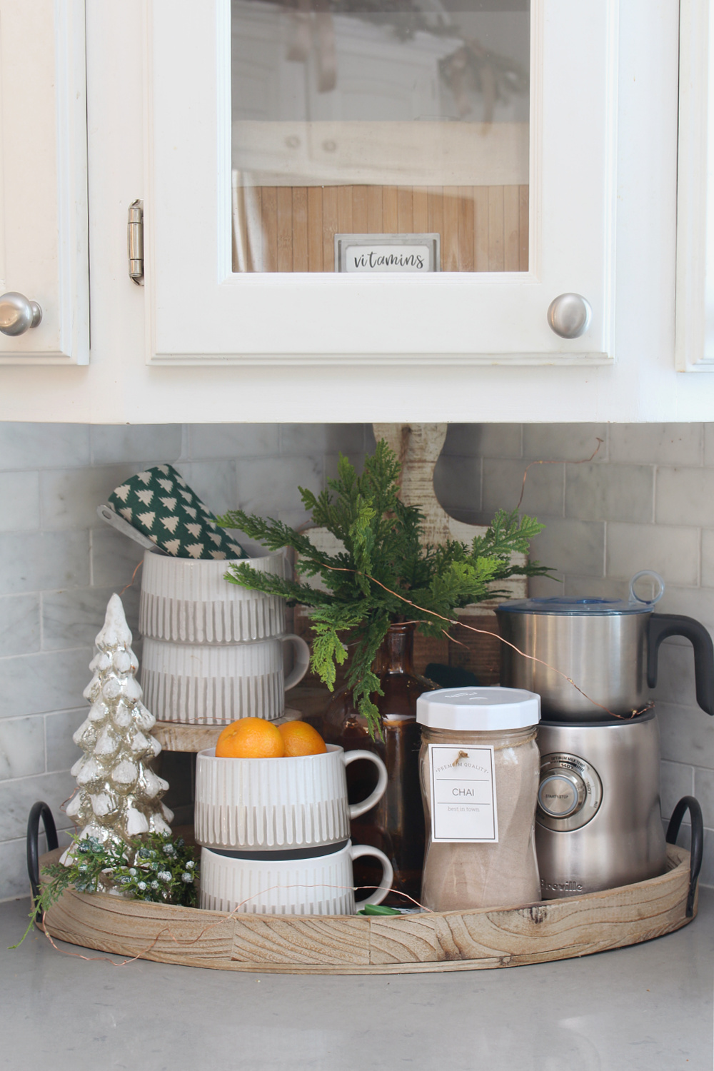 Wooden tray decorated as a Christmas hot chocolate bar.