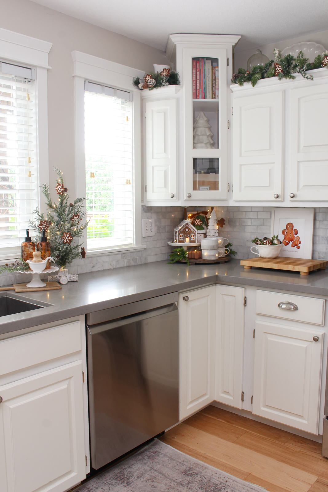 White kitchen decorated for Christmas with a gingerbread inspired theme.